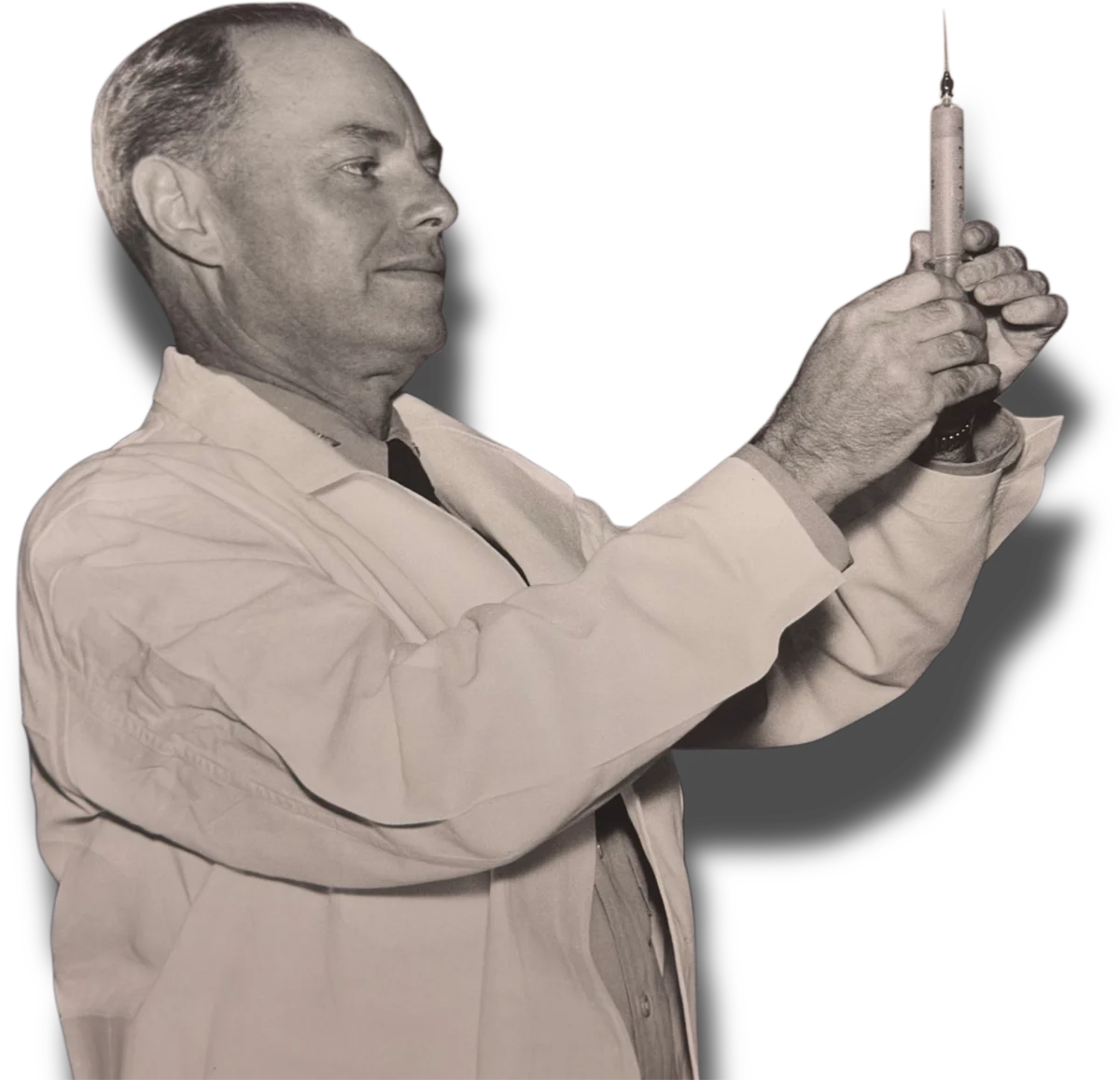 Richard L. Bohannon in a white medical coat holding a syringe